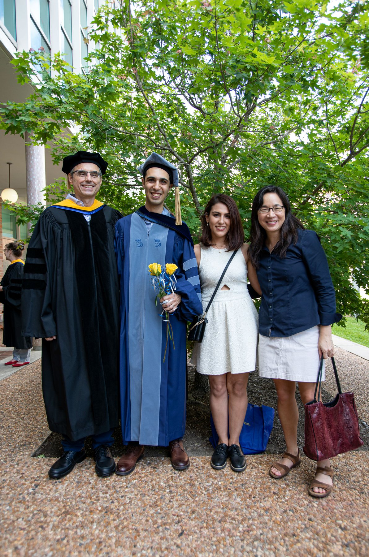 Sahand Hajimirza in doctoral regalia at his graduation, with Helge, Sahar and Elizabeth