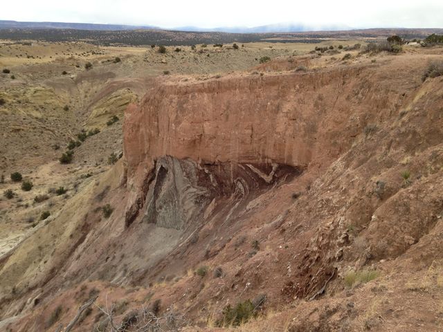 Intensely folded Summerville Fm. overlain by Quaternary pediment deposits