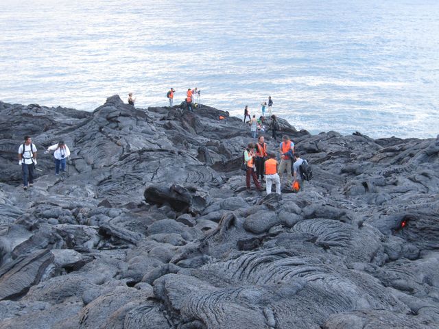 Volcanologists on fresh Pahoehoe flow